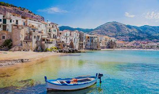 Boat in crystal clear sea of Sicily, Europe